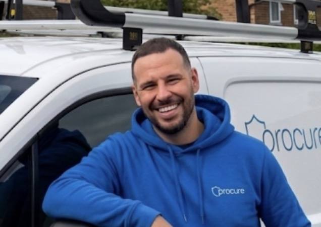 A Procure Group technician with a company van